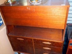 A retro teak bureau cabinet