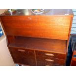 A retro teak bureau cabinet