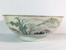 A circa 19th century Qianjiang bowl depicting rural setting with hills in background and with iron