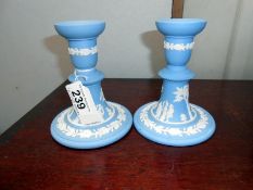 A pair of Wedgwood blue jasper candlesticks