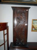 A carved front cupboard