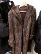 A full length fur coat (no labels)
