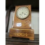 A marquetry inlaid mantel clock