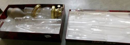 2 boxes of glass oil lamp chimneys and a brass burner