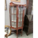 A dome top Edwardian inlaid display cabinet