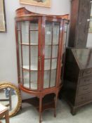 A dome top Edwardian inlaid display cabinet