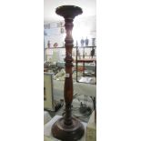 A mahogany torchere