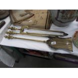 A set of 3 brass fire irons comprising shovel,