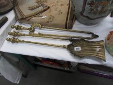 A set of 3 brass fire irons comprising shovel,