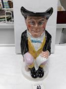 A 19th century Staffordshire Toby jug (has scuffs to right arm)