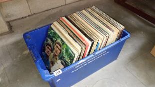 A box of approximately 100 LP records