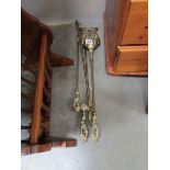 A set of 3 brass fire irons comprising shovel,