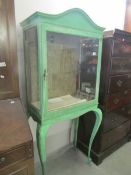 A painted display cabinet