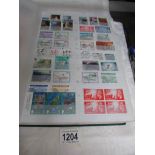 A album of GB and world stamps including GB mint blocks, pairs,