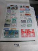 A album of GB and world stamps including GB mint blocks, pairs,