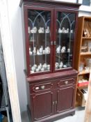 A mahogany glazed top display cabinet