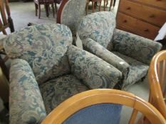 A pair of arm chairs