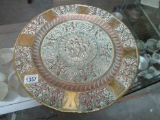 A large Asian silver and brass plaque