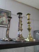 A pair of Victorian brass candlesticks and a pair of a/f telescopic candlesticks