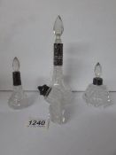 4 glass perfume bottles with silver collars