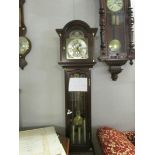 A Hermle triple chime Grandfather clock,