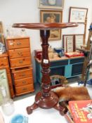 A mahogany pedestal occasional table