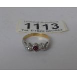 An 18ct gold ruby and diamond 3 stone ring