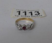 An 18ct gold ruby and diamond 3 stone ring