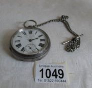 A silver pocket watch a/f, on a silver chains,