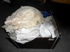 A box of vintage lace including wedding dress