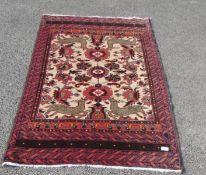 A red and beige patterned rug,