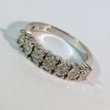 An 18ct gold diamond band ring with 7 diamonds