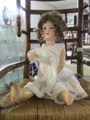 A large Armand Marsielle bisque headed doll with composite body