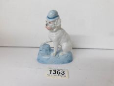 A figure of a bulldog in a bowler hat