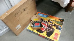A Scalextric model motor racing set with transformer