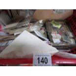 A large quantity of loose world stamps including some mint