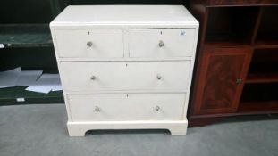 A painted 2 over 2 chest of drawers