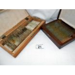 2 wooden boxes containing glass slides for microscopes