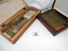 2 wooden boxes containing glass slides for microscopes