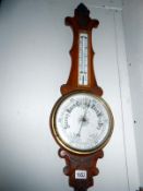 An Edwardian oak aneroid barometer