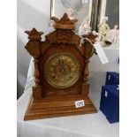 An Ansonia mantel clock with key,