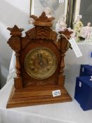 An Ansonia mantel clock with key,