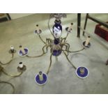 A 6 lamp brass and ceramic ceiling light