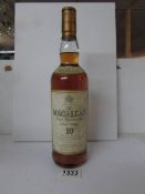 An unopened bottle of Macallan 10 year old malt whisky