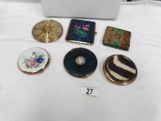 5 powder compacts and a pocket magnifier