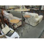 A breakfast table and pair of bar stools