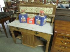 A marble top wash stand with tiled back