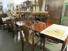 An extending mahogany dining table with 6 chairs (all chairs a/f)