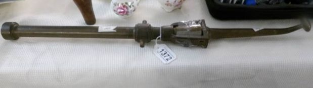 A replica of a 19th century poachers gun in brass