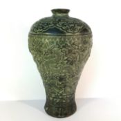 An eastern bronze vase decorated with dragons